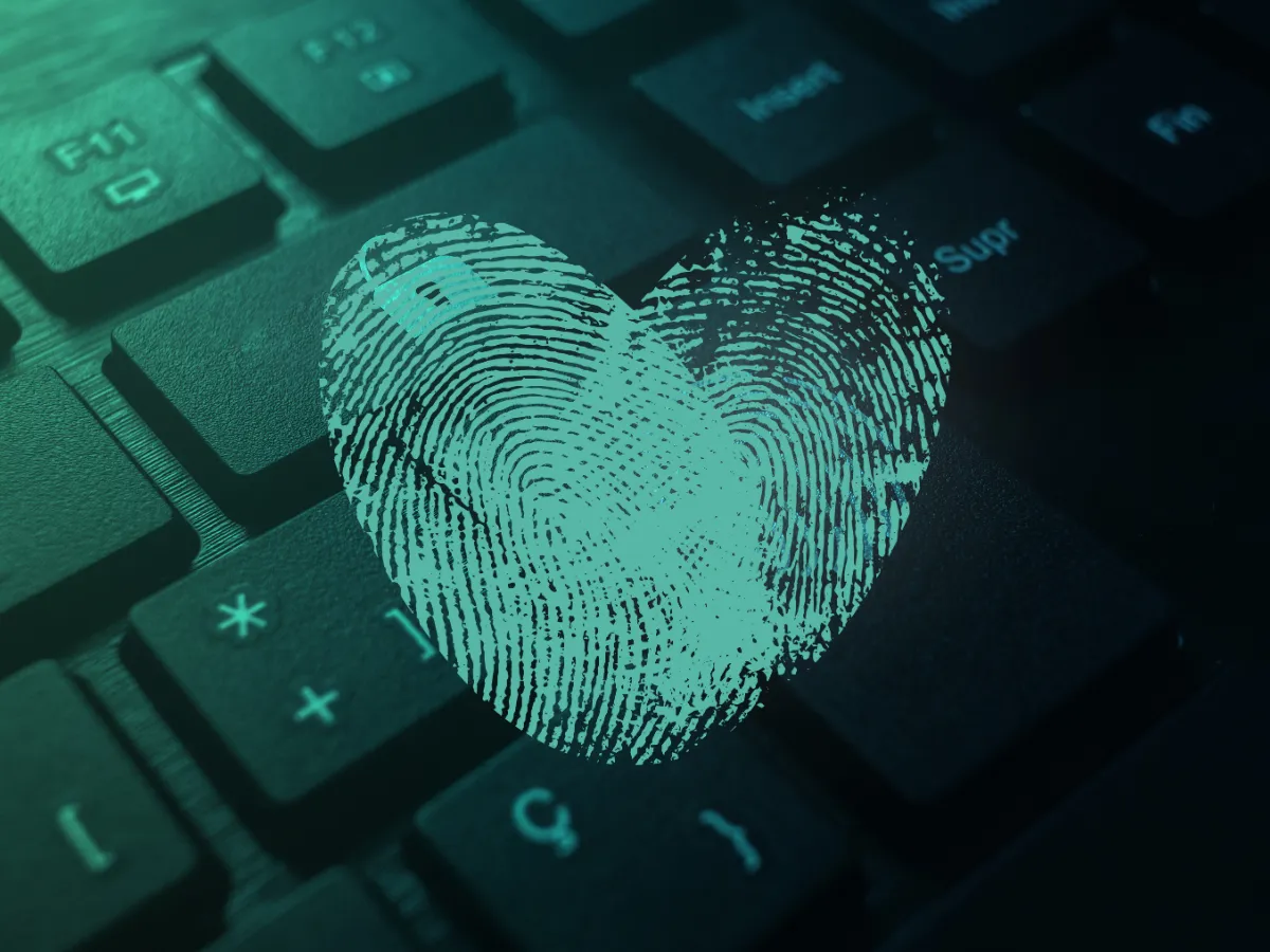 Fingerprint in a heart shape over keyboard, representing full data privacy with local AI when using Ollama GPT from HomeDock OS